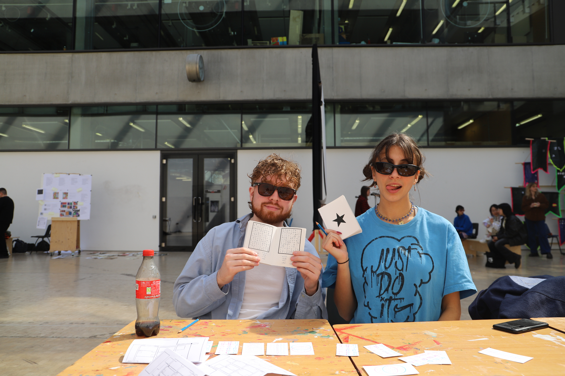Two students at the workshop table